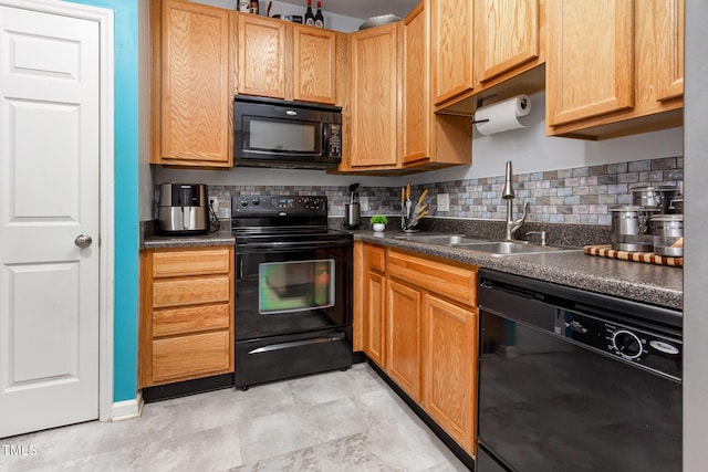 320 Gilman Ln Unit 106, Raleigh, NC 27610 - kitchen featuring black appliances, dark countertops, and backsplash