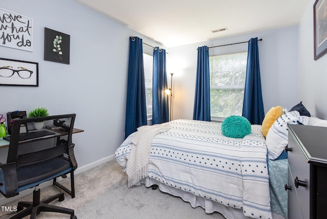 320 Gilman Ln Unit 106, Raleigh, NC 27610 - carpeted bedroom featuring a desk and baseboards