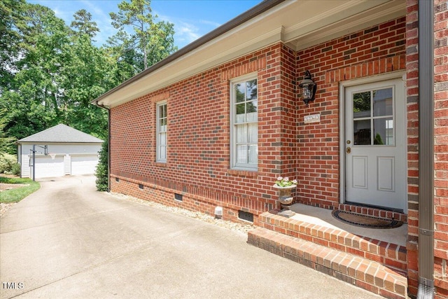 1313 Duplin Rd, Raleigh, NC 27607 - property entrance featuring crawl space, a detached garage, and brick siding
