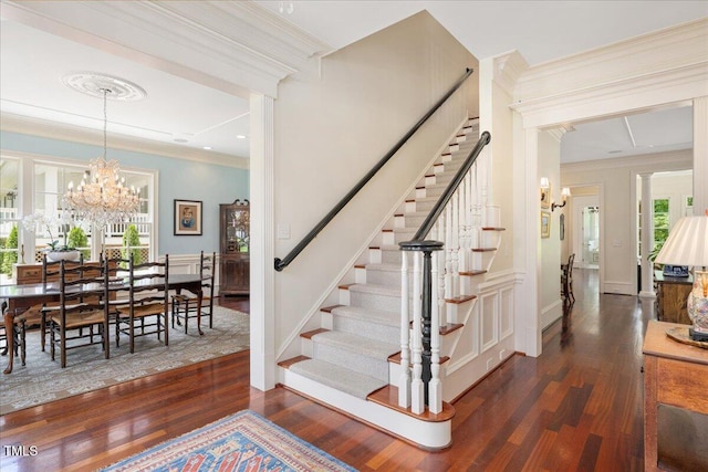 1313 Duplin Rd, Raleigh, NC 27607 - stairway with wood finished floors, ornamental molding, and a chandelier