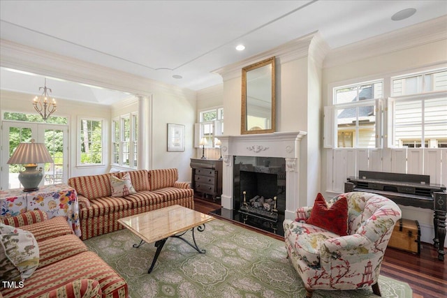 1313 Duplin Rd, Raleigh, NC 27607 - living room featuring ornamental molding, a chandelier, wood finished floors, and a fireplace
