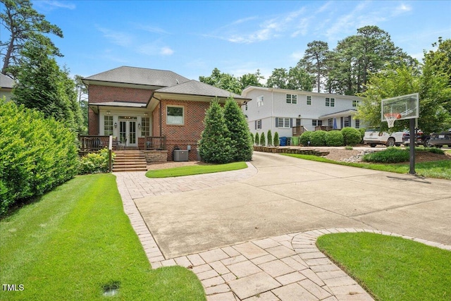 1313 Duplin Rd, Raleigh, NC 27607 - rear view of house featuring brick siding, french doors, and a yard