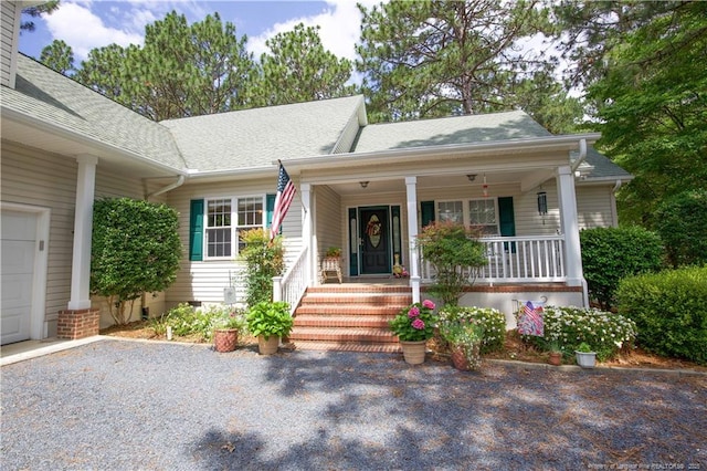 957 Blackeyed Susan Pl, Vass, NC 28394 - view of front of property with covered porch, crawl space, and a shingled roof