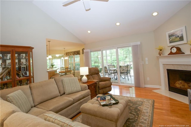 957 Blackeyed Susan Pl, Vass, NC 28394 - living area featuring recessed lighting, ceiling fan, light wood-style floors, a premium fireplace, and high vaulted ceiling