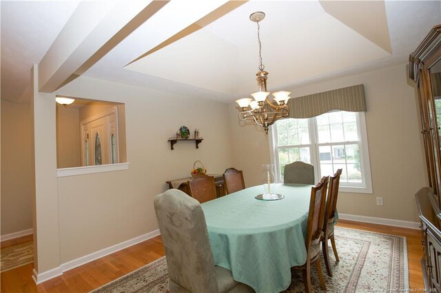 957 Blackeyed Susan Pl, Vass, NC 28394 - dining room featuring a chandelier and wood finished floors