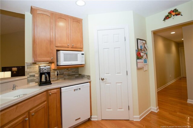 957 Blackeyed Susan Pl, Vass, NC 28394 - kitchen with white appliances, decorative backsplash, light wood-style floors, light countertops, and recessed lighting