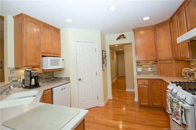 957 Blackeyed Susan Pl, Vass, NC 28394 - kitchen with white appliances, recessed lighting, tasteful backsplash, light wood-style flooring, and light countertops