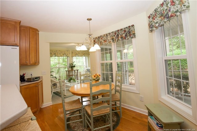 957 Blackeyed Susan Pl, Vass, NC 28394 - dining area featuring light wood finished floors and a chandelier