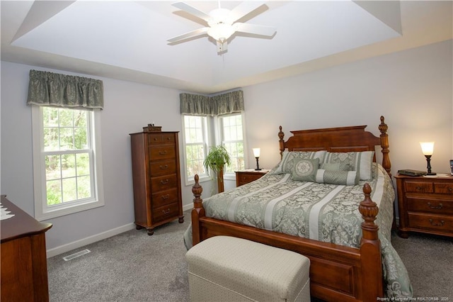 957 Blackeyed Susan Pl, Vass, NC 28394 - carpeted bedroom featuring a raised ceiling and a ceiling fan