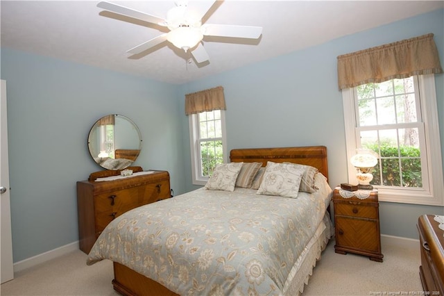957 Blackeyed Susan Pl, Vass, NC 28394 - carpeted bedroom featuring multiple windows and a ceiling fan