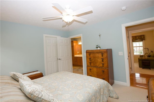 957 Blackeyed Susan Pl, Vass, NC 28394 - bedroom with light colored carpet, ceiling fan, and a closet