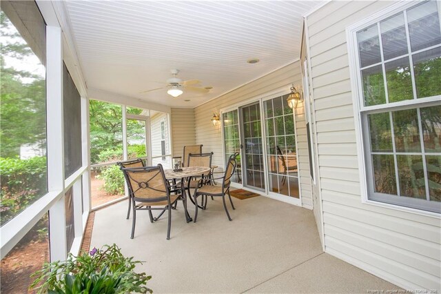 957 Blackeyed Susan Pl, Vass, NC 28394 - sunroom with ceiling fan and outdoor dining area