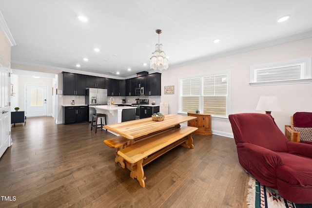 1247 White Flint Cir, Durham, NC 27703 - dining area with ornamental molding, a chandelier, dark wood-style flooring, plenty of natural light, and recessed lighting