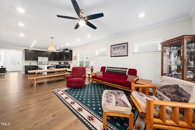 1247 White Flint Cir, Durham, NC 27703 - living area with ornamental molding, recessed lighting, wood finished floors, and ceiling fan