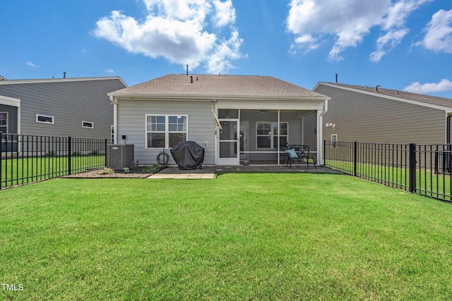 1247 White Flint Cir, Durham, NC 27703 - rear view of property featuring a sunroom, a fenced backyard, a patio area, and a shingled roof