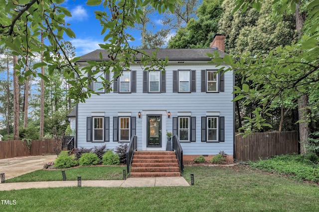 7917 Featherstone Dr, Raleigh, NC 27615 - view of front of home featuring a chimney and a shingled roof