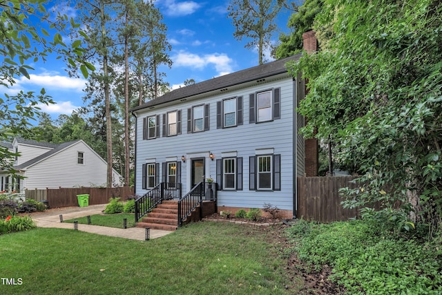 7917 Featherstone Dr, Raleigh, NC 27615 - colonial-style house featuring a chimney