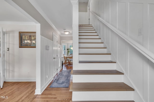 7917 Featherstone Dr, Raleigh, NC 27615 - stairs with wood finished floors and crown molding