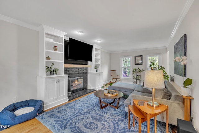 7917 Featherstone Dr, Raleigh, NC 27615 - living room with wood finished floors, crown molding, and a fireplace