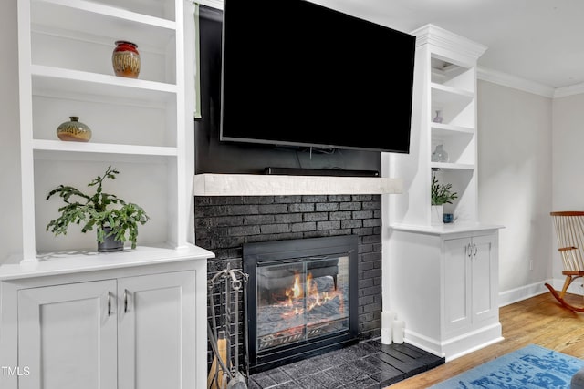 7917 Featherstone Dr, Raleigh, NC 27615 - living room with ornamental molding, light wood finished floors, and a brick fireplace