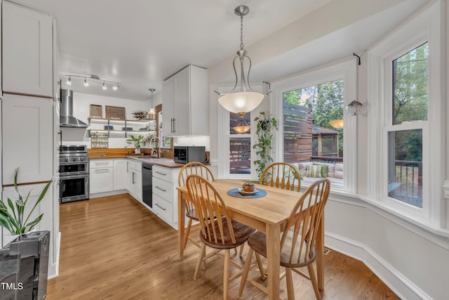 7917 Featherstone Dr, Raleigh, NC 27615 - dining space featuring light wood finished floors