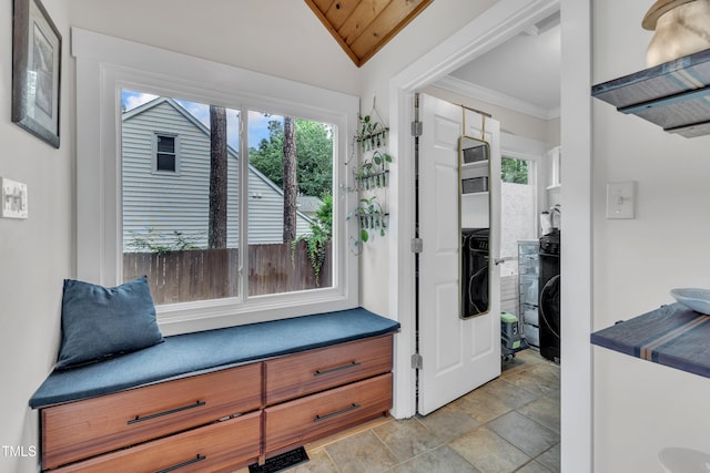 7917 Featherstone Dr, Raleigh, NC 27615 - living area with light stone finish floors, lofted ceiling, and crown molding