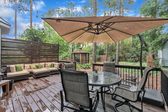7917 Featherstone Dr, Raleigh, NC 27615 - deck with an outdoor hangout area, outdoor dining area, and a fenced backyard