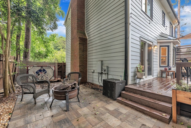 7917 Featherstone Dr, Raleigh, NC 27615 - fenced backyard featuring a wooden deck and a patio
