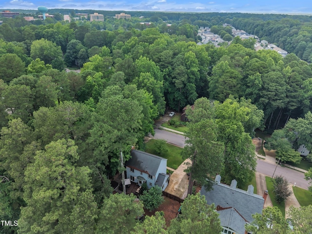 7917 Featherstone Dr, Raleigh, NC 27615 - aerial view of property and surrounding area with a heavily wooded area