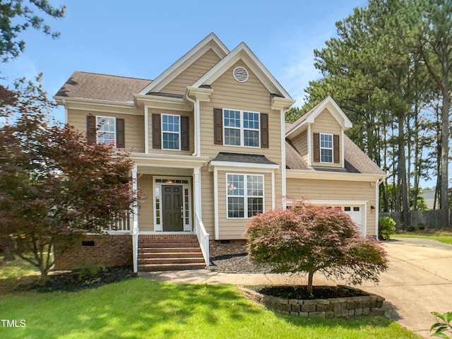 1201 Dagmar Ln, Wake Forest, NC 27587 - view of front of home with concrete driveway, a front lawn, roof with shingles, and an attached garage