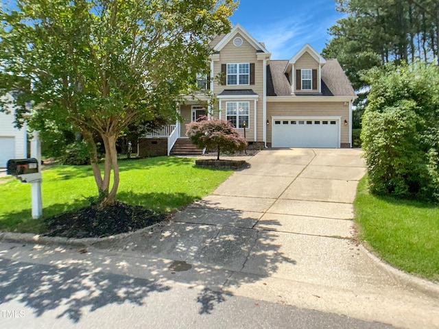 1201 Dagmar Ln, Wake Forest, NC 27587 - view of front facade featuring driveway, a front yard, and roof with shingles