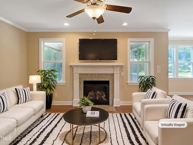 1201 Dagmar Ln, Wake Forest, NC 27587 - living room with wood finished floors, crown molding, ceiling fan, recessed lighting, and a fireplace with flush hearth