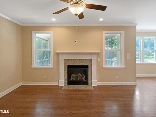 1201 Dagmar Ln, Wake Forest, NC 27587 - unfurnished living room featuring ornamental molding, a fireplace with flush hearth, wood finished floors, a ceiling fan, and recessed lighting