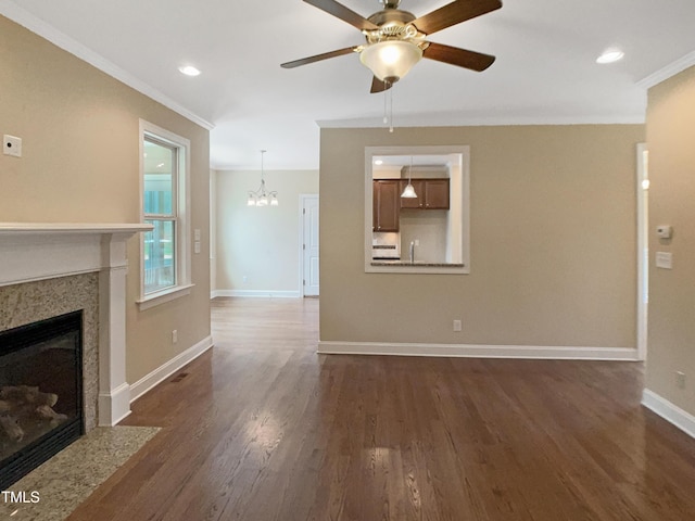 1201 Dagmar Ln, Wake Forest, NC 27587 - unfurnished living room with crown molding, a fireplace, a chandelier, dark wood-type flooring, and a ceiling fan