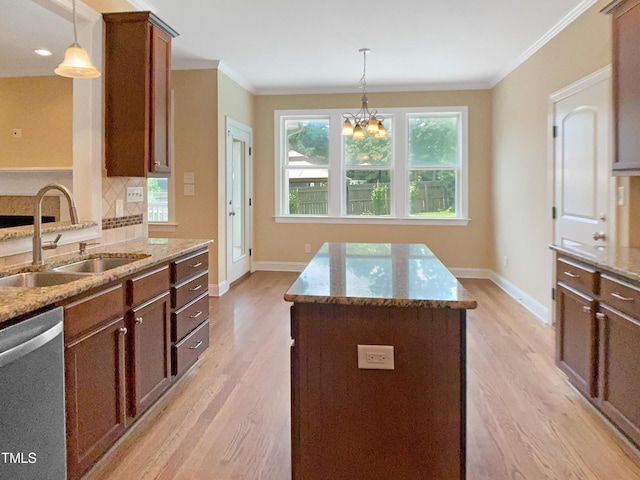 1201 Dagmar Ln, Wake Forest, NC 27587 - kitchen with stainless steel dishwasher, light wood finished floors, light stone counters, and crown molding