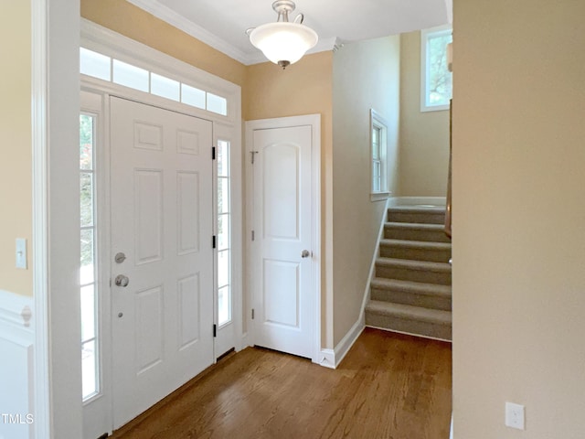 1201 Dagmar Ln, Wake Forest, NC 27587 - entrance foyer with wood finished floors, stairs, crown molding, and plenty of natural light