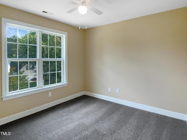 1201 Dagmar Ln, Wake Forest, NC 27587 - unfurnished room featuring dark carpet and a ceiling fan