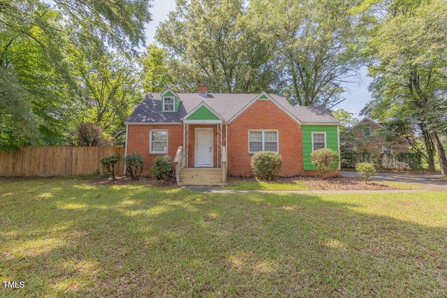301 N King Charles Rd, Raleigh, NC 27610 - bungalow-style home with brick siding and a chimney