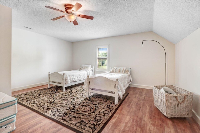 116 Twin Oaks Pl, Goldsboro, NC 27530 - bedroom featuring a textured ceiling, wood finished floors, and a ceiling fan
