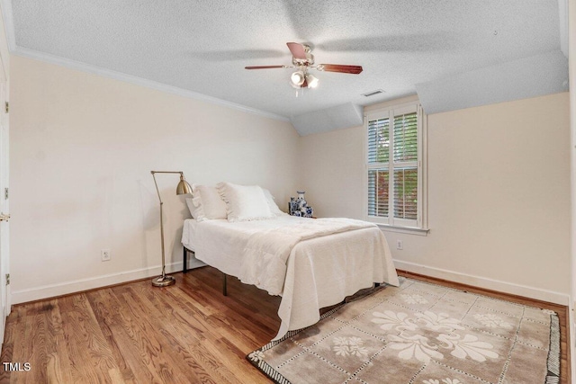 116 Twin Oaks Pl, Goldsboro, NC 27530 - bedroom with a textured ceiling, crown molding, light wood-style floors, and ceiling fan