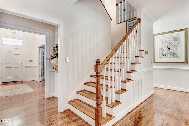 116 Twin Oaks Pl, Goldsboro, NC 27530 - stairs with wood finished floors and ornamental molding
