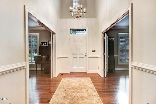 116 Twin Oaks Pl, Goldsboro, NC 27530 - entrance foyer with a chandelier, dark wood-style flooring, and a towering ceiling