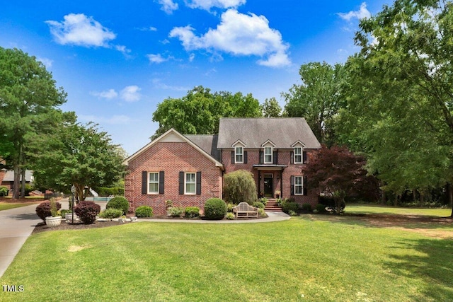 116 Twin Oaks Pl, Goldsboro, NC 27530 - view of front of house with brick siding and a front yard