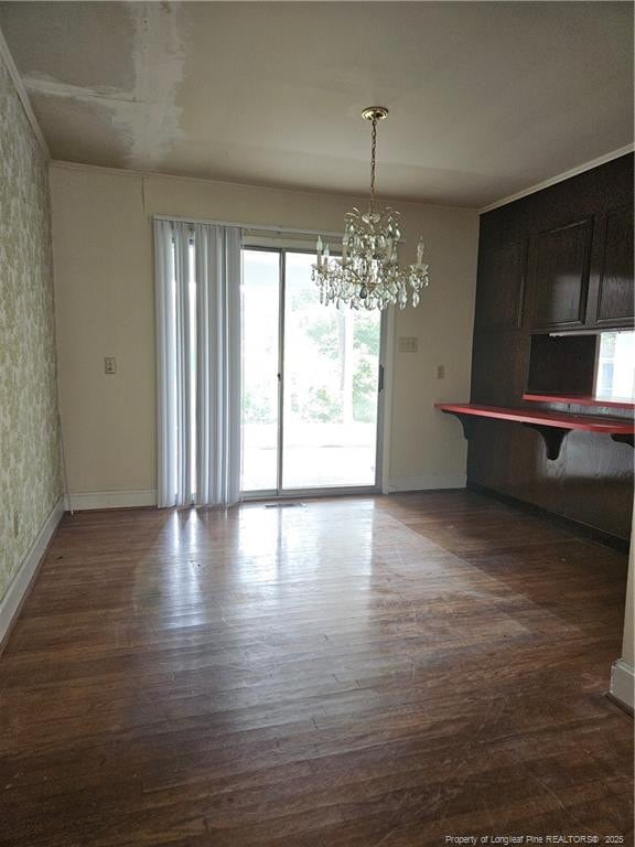 2943 Ole Bluff Mill Rd, Fayetteville, NC 28306 - unfurnished dining area featuring a chandelier and wood finished floors