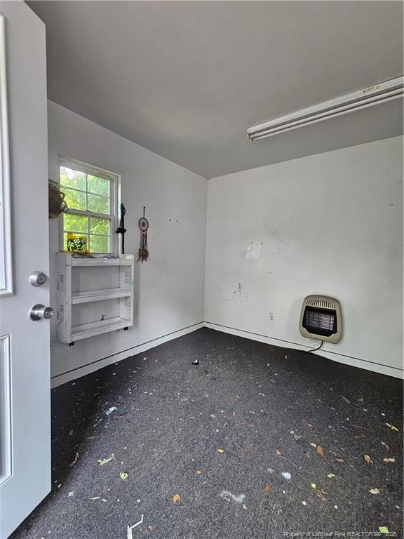 2943 Ole Bluff Mill Rd, Fayetteville, NC 28306 - spare room with heating unit and baseboards