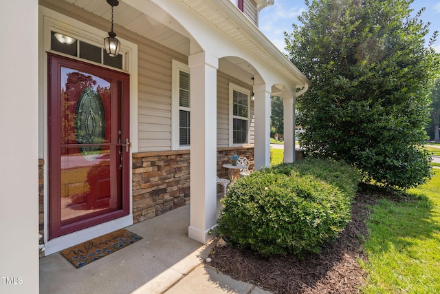 200 Woodvale Way, Fuquay Varina, NC 27526 - doorway to property featuring a porch and stone siding