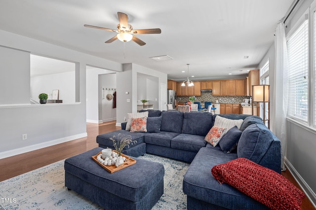 200 Woodvale Way, Fuquay Varina, NC 27526 - living room featuring light wood-type flooring, ceiling fan, and healthy amount of natural light