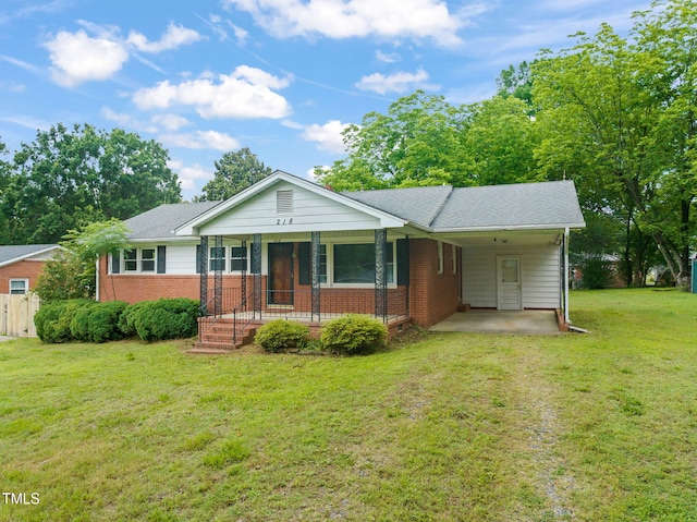 218 Forestville Rd, Wake Forest, NC 27587 - ranch-style house with a carport, brick siding, a porch, a front lawn, and driveway