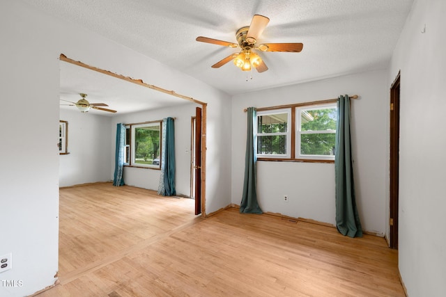 218 Forestville Rd, Wake Forest, NC 27587 - empty room with ceiling fan, light wood-type flooring, and a textured ceiling