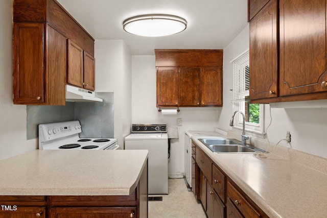 218 Forestville Rd, Wake Forest, NC 27587 - kitchen with white electric range oven, washer / dryer, under cabinet range hood, and light countertops